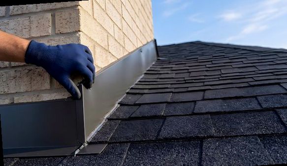 New metal flashing edge fitted by hand against light brick